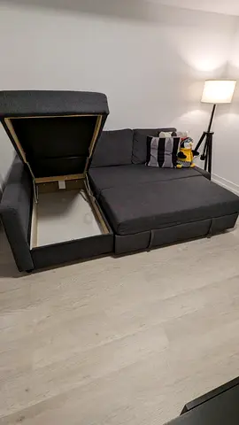 Grey L-shaped sofa with chaise and storage - good condition