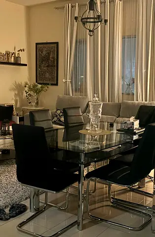 Modern Glass Dining Table with Stylish Black Chairs