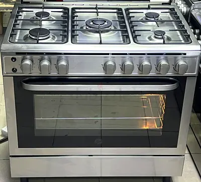 Im selling my stainless steel 5-burner gas range with oven — working condition
