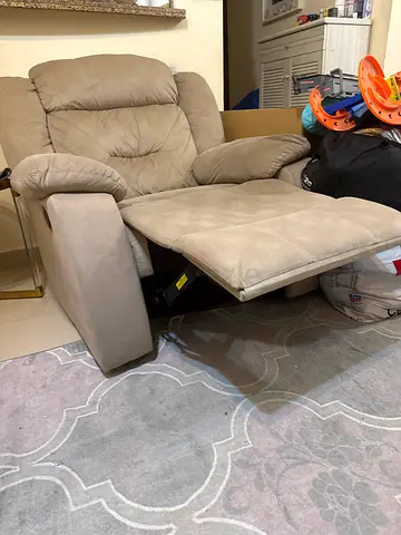 Beige reclining armchair with footrest - good condition