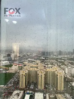 One-bedroom apartment with a living room for annual rent at Al Waha Towers in Al Rashidiya 1 area, f