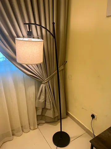 Used black arc floor lamp with beige fabric shade