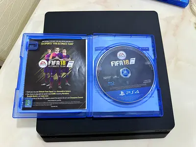 PlayStation 4 with 2 CDs Fifa 18 and GTA5