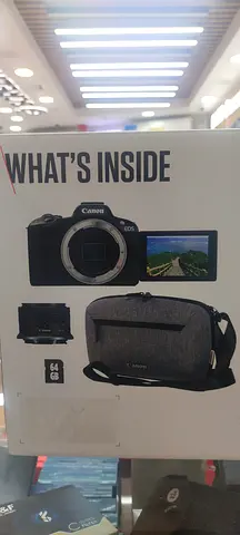 Canon mirrorless kit — camera body + kit lens and bag (used)