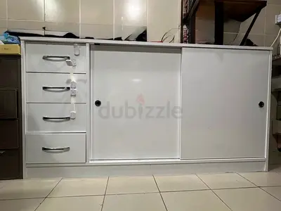 White sliding cabinet with 4 drawers - good condition