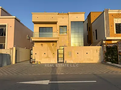 A villa for sale in Al Muwaihat, Ajman, with all utilities (electricity, water, and air conditioning) included. Located on the main street, ready to m