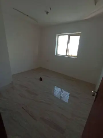 - Two rooms and a hall in Al Khan, Sharjah - Kitchen + 2 bathrooms + large spaces - Officially for bachelors