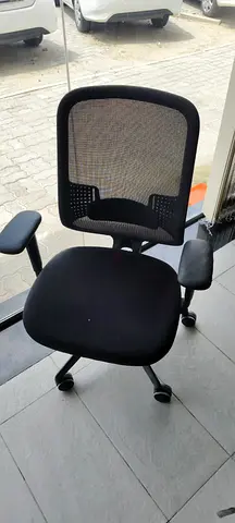 Black mesh office chair with armrests - good condition