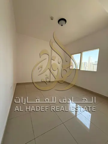 Two-bedroom apartment with a living room, free parking, and a balcony in the Al Taawun area, next to Al Taawun roundabout and Al Baik restaurant.