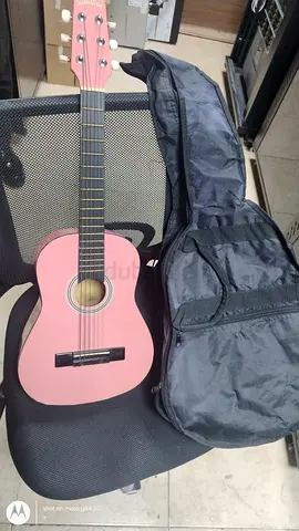For sell urgent.    Lightly used pink acoustic guitar with gig bag