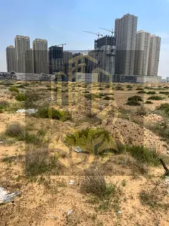 Corner plot of land on Mohammed Bin Zayed Road, residential/commercial, G+25 , in Al Alia area | Exc