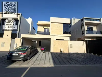 Villa for sale in Al Yasmin, Ajman. 5 bedrooms, living room, majlis, spacious kitchen, and maid's room.