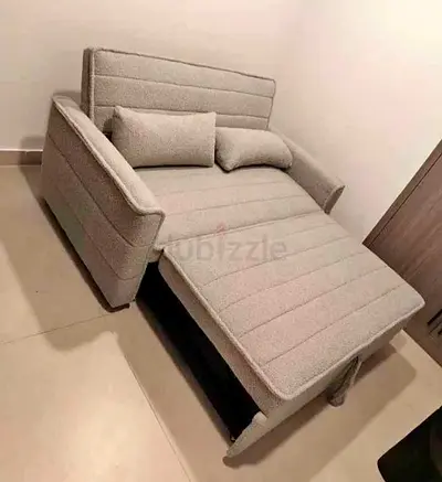 Light grey pull-out single sofa bed — used, good condition