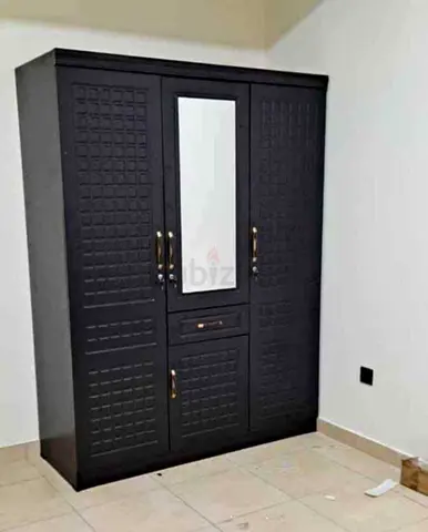 My black 3-door wardrobe with center mirror — used, sturdy