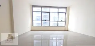 For sale in Sharjah, Al Nahda area: Master bedroom and living room