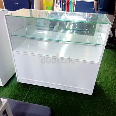 Selling my white glass-top retail display counter with glass shelves
