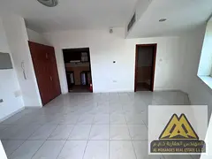 Studio for annual rent – Al Rashidiya 3 – Ajman Behind Grand Mall Semi-separated kitchen Balcony