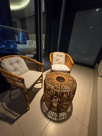 Rattan patio set - 2 cushioned chairs with round side table