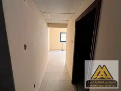 Studio apartment for annual rent in Al Nuaimiya 2, Ajman. Spacious area, semi-separate kitchen. Spec