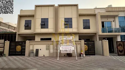 A villa for sale in Al Muwaihat, Ajman, with all utilities (electricity, water, and air conditioning) included. Located on the main street, ready to m