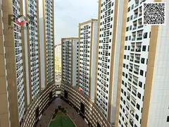 Own a two-bedroom apartment with a living room in the Pearl Towers, featuring a balcony, parking, an