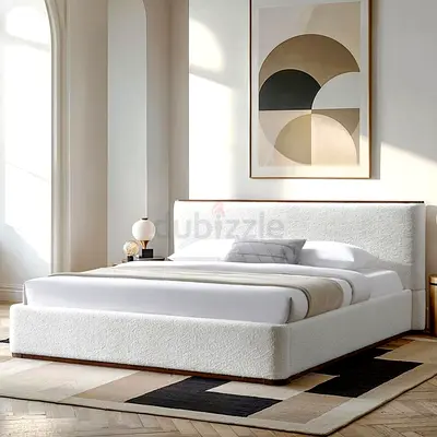 White upholstered platform bed with padded headboard - gently used