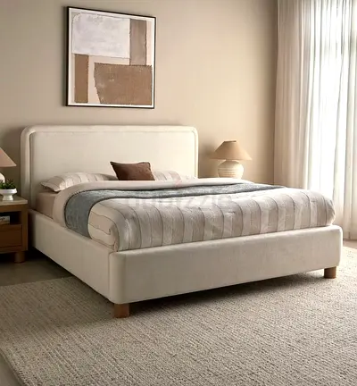Cream upholstered bed frame with padded headboard - gently used