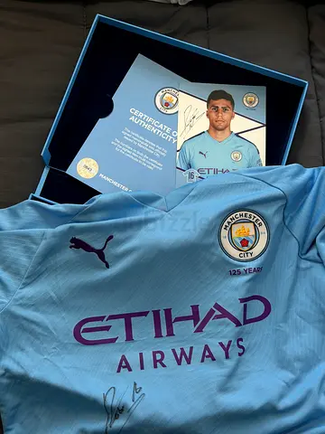 Signed Manchester City Home Jersey with Certificate of Authenticity