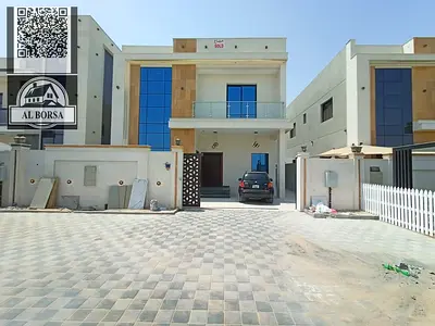 For rent a villa in Al Helio 2 in Ajman, 5 master bedrooms, a majlis, a hall, a maid's room, and a store