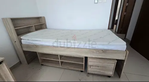 Light wood single storage bed with headboard shelves and drawers
