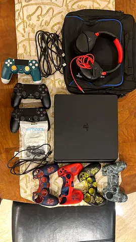 PS4 SLIM 1 TB + 2 controllers+ extras+ cooling fan (excellent condition)