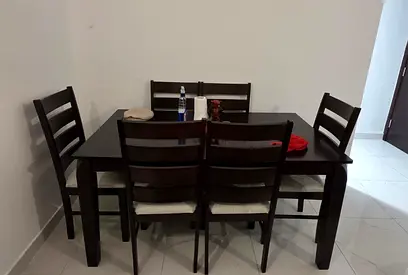 6-seater dark wood dining table with chairs