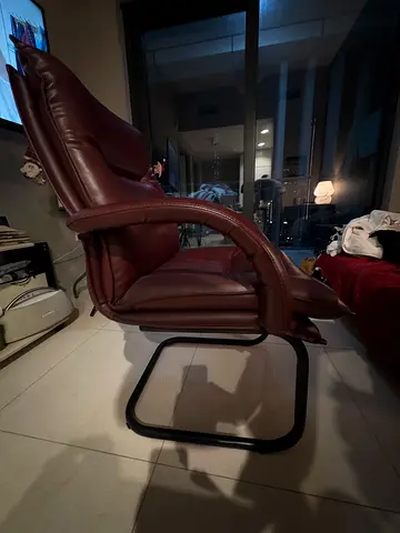 Brown leather lounge/recliner chair with metal cantilever base