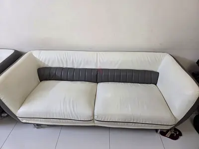 White faux-leather 3-seater sofa with grey trim