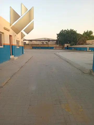 20,000 sq ft yard, 50 kW | Main road | 6 rooms, offices, bathroom | Interlock | Open shed