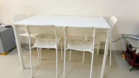 White Dining Table with Four Chairs from IKEA