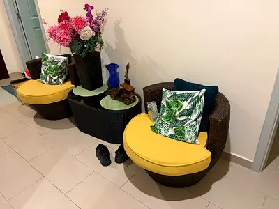 Set of two rattan round chairs with cushions and matching side table