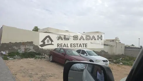 Land for sale in Al Jazat, second plot from a main street, area 8000 sq ft, asking price 800,000