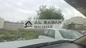 Land for sale in Al Jazat, second plot from a main street, area 8000 sq ft, asking price 800,000