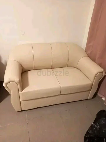 Cream 2-seater loveseat — good condition