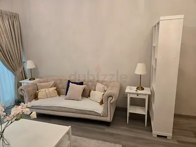 Elegant Cream Chesterfield Sofa with matching Side Table