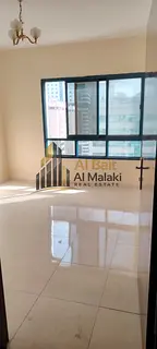 Three-bedroom apartment with a living room for annual rent in Al Majaz 3, prime location and excelle