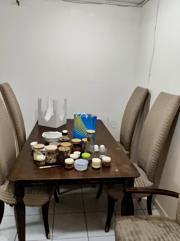 Solid wooden dining table with 4 upholstered chairs