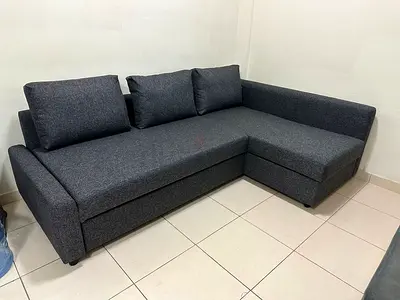 Space-saving corner sofa bed with smart lifting system and extra storage.