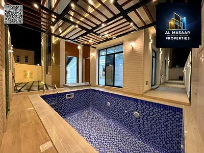 Luxury villa for sale in Al Helio 2, Ajman. Electricity and water included. Prime location directly on the main road and close to all amenities.