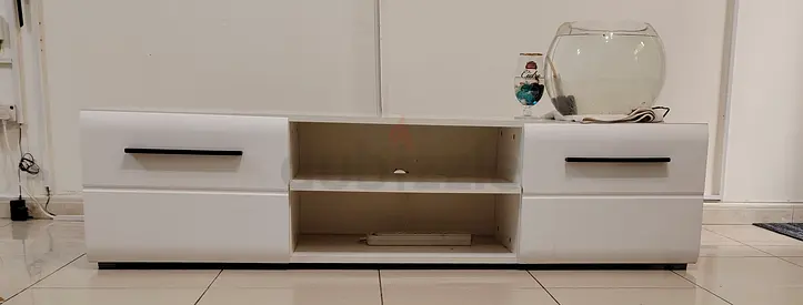 White TV unit with drawers and open shelf