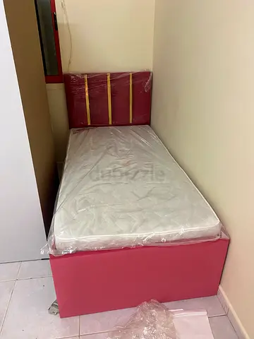 Single upholstered bed with mattress and headboard shelves (good condition)
