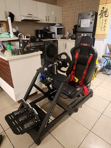 Racing simulator frame, chair, and monitor.