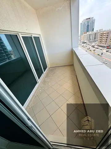 Parking, swimming pool, and garden | Ajman One Towers Al Rashidiya 3 | One-bedroom apartment with full sea view | Master bedroom with spacious living