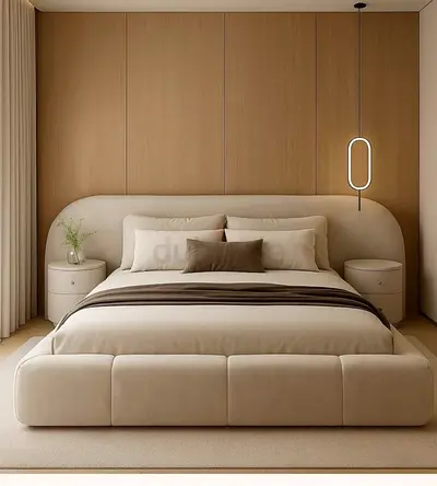 beige upholstered bed frame with curved headboard and bedside tables